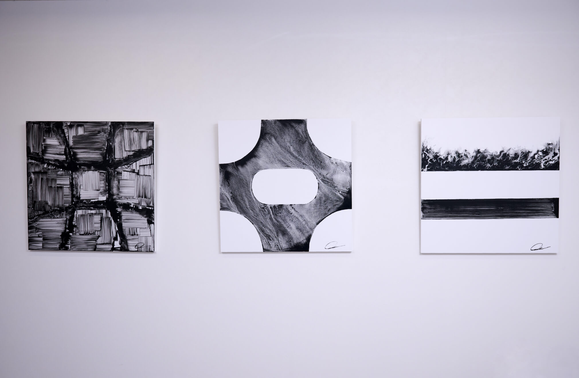 Photo of (From left) TESHIMA #16 ~2025.8.7~ / 803mm×803mm / original ink and Teshima's sand on paper / 2025, TESHIMA #2 ~2025.10.18~ / 803mm×803mm / original ink and Teshima's sand on paper / 2025, TESHIMA #2 ~2025.12.1~ / 803mm×803mm / original ink and Teshima's sand on paper / 2025